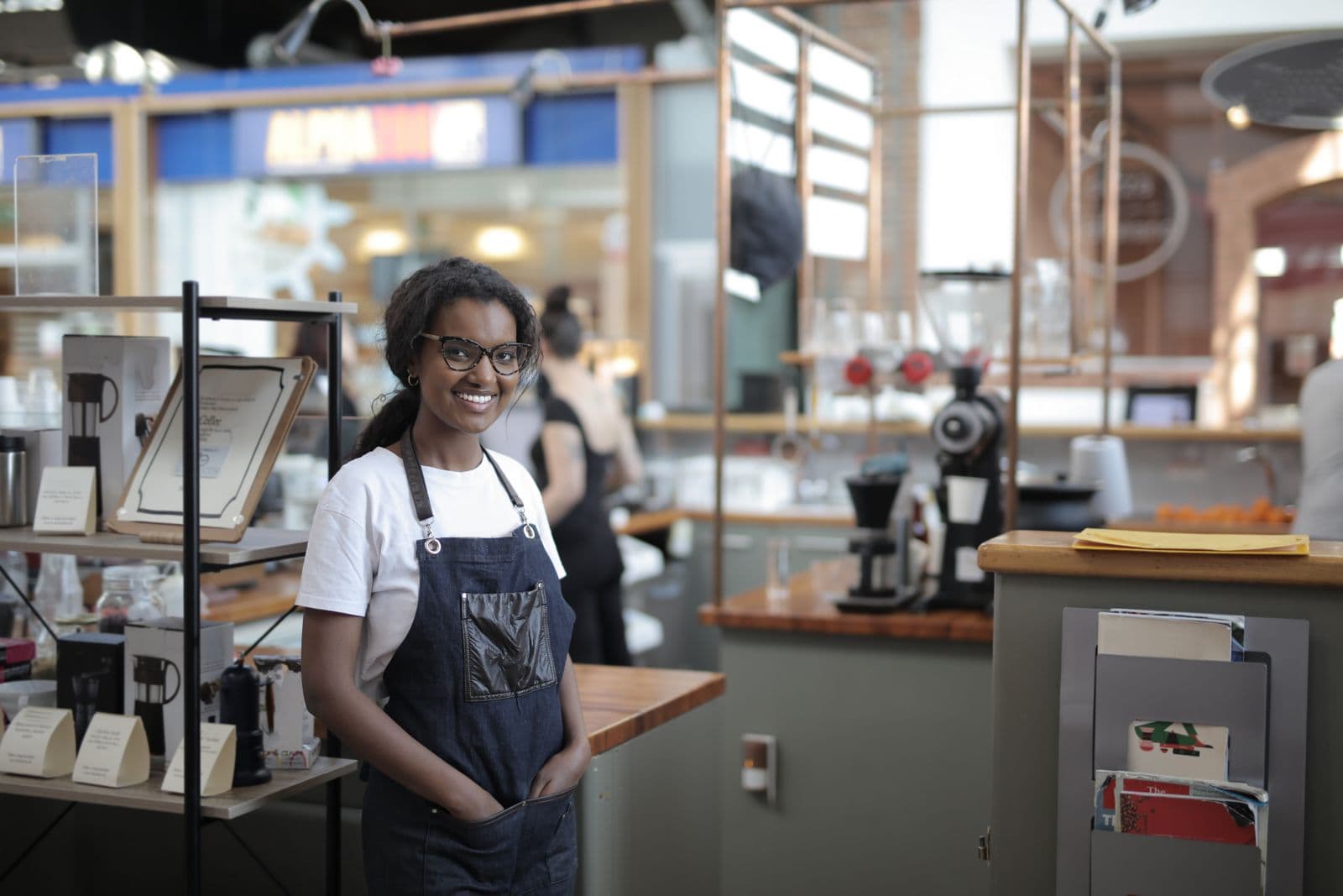 A small business owner standing in her shop